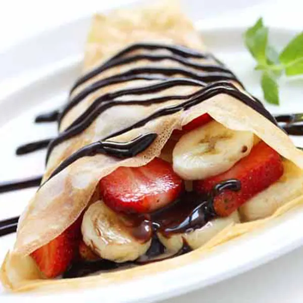 Crepes Served with Fruit and Chocolate Sauce
